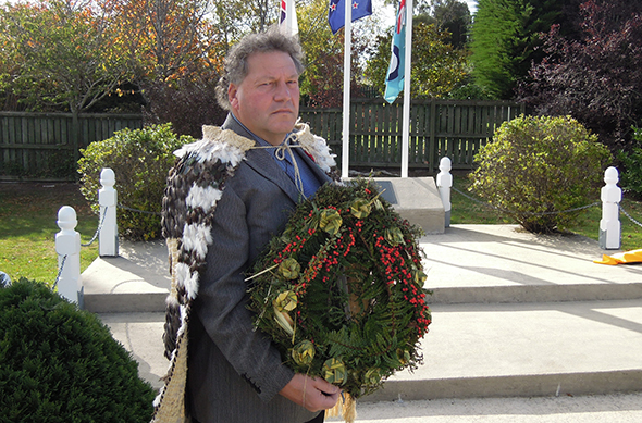 Bruce with the wreath at the memorial plinth.