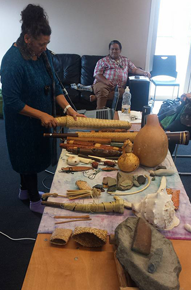 Mahina showing all her taonga and explaining how these items might have been used around Māori births.