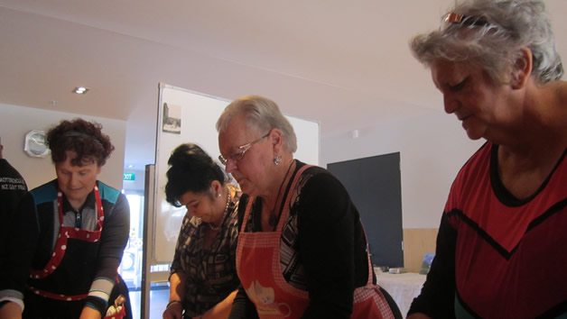 Our whānau hard at work in the kitchen.