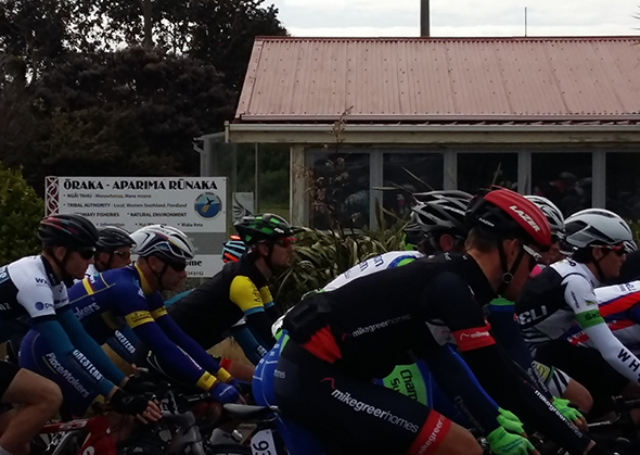 Riders on their way past the marae office.