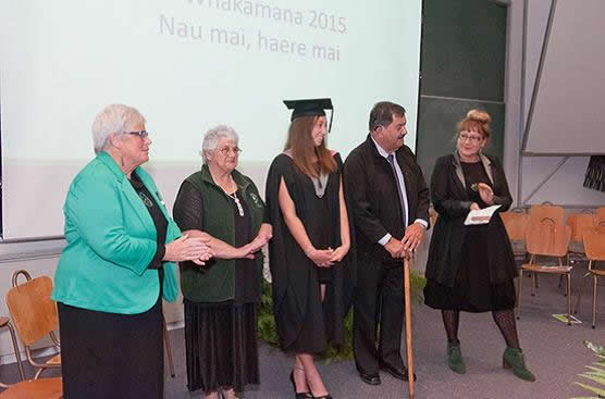 Te Taumutu Rūnanga members with one of the graduates. 
