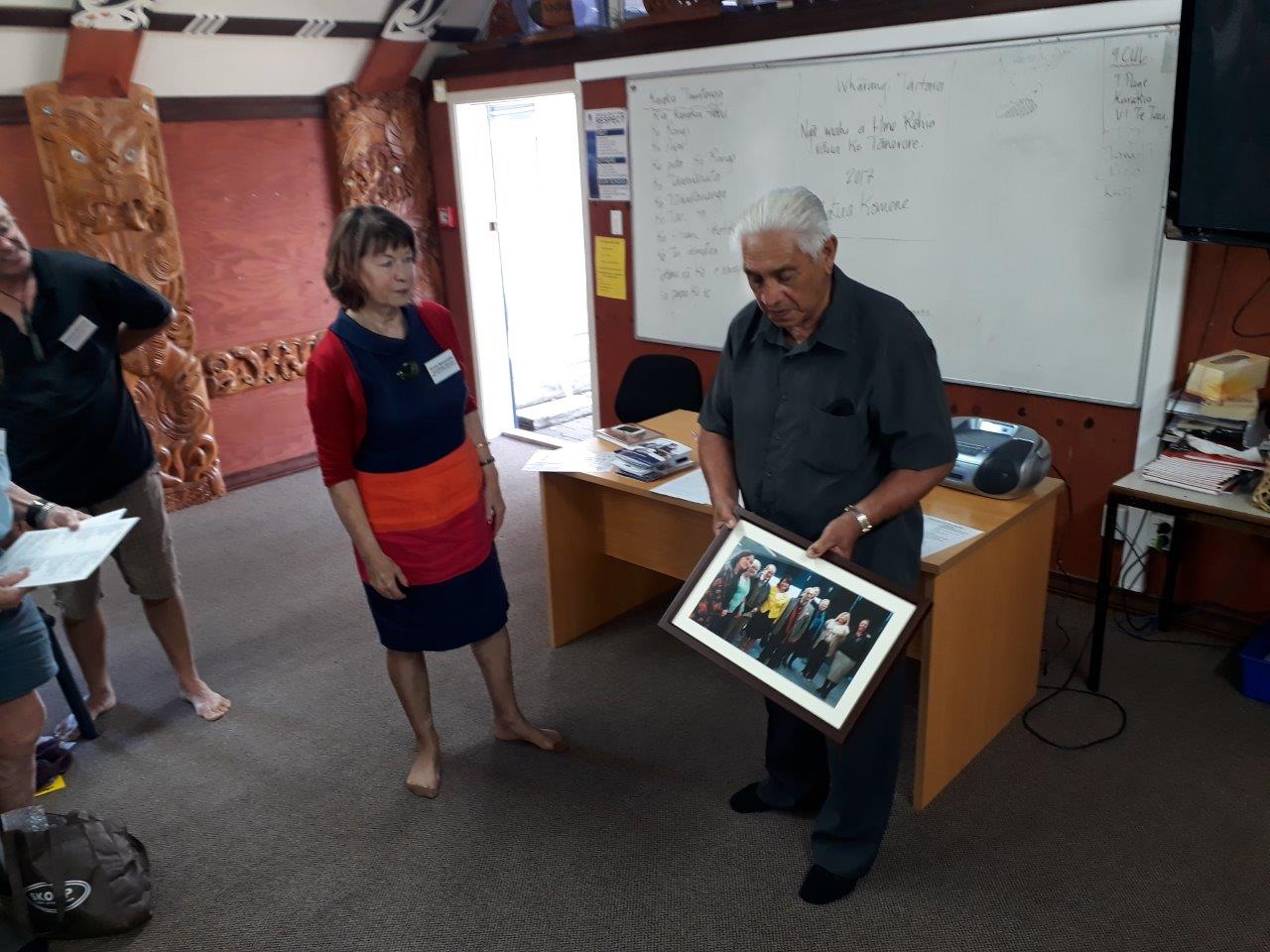 Uncle Joe showing the rōpū a photo of Laurie Lopers visit to Te Waipounamu.