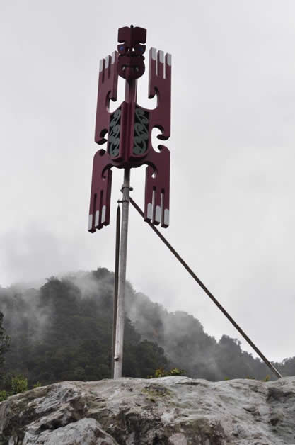 ‘Kahukura’ The first poupou unveiled rises majestically with a background of forest and mist in the Fiordland National Park. 